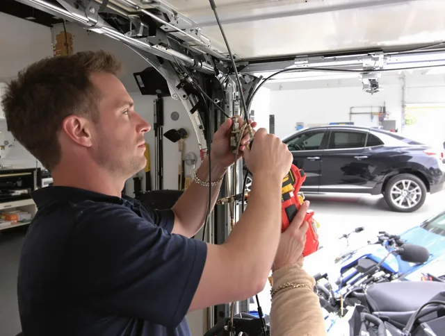 Waxhaw Garage Door Repair safety certified technician performing cable replacement in Waxhaw