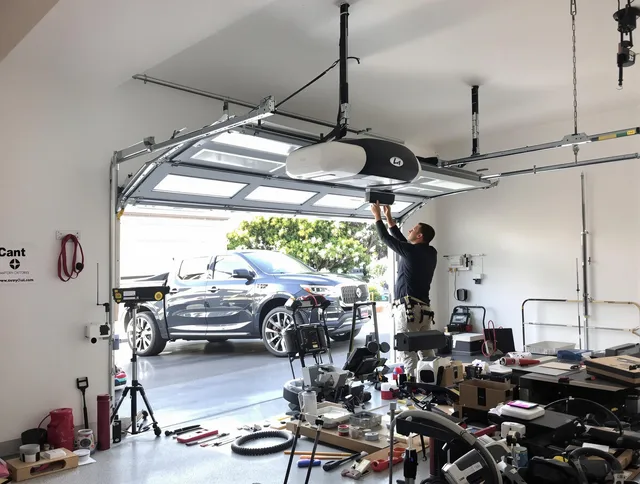 Waxhaw Garage Door Repair specialist installing smart garage door opener system in Waxhaw home