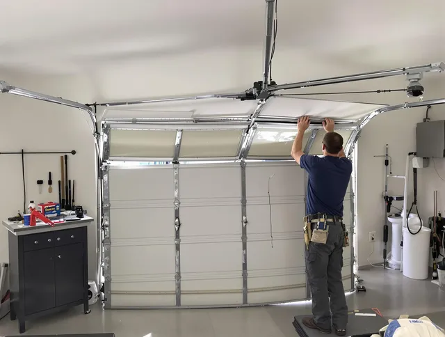 Waxhaw Garage Door Repair specialist performing precise section replacement on Waxhaw garage door